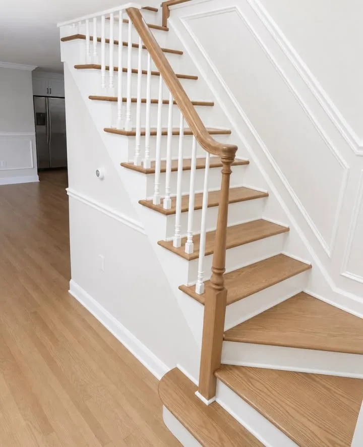 Refinished oak staircase with white spindles